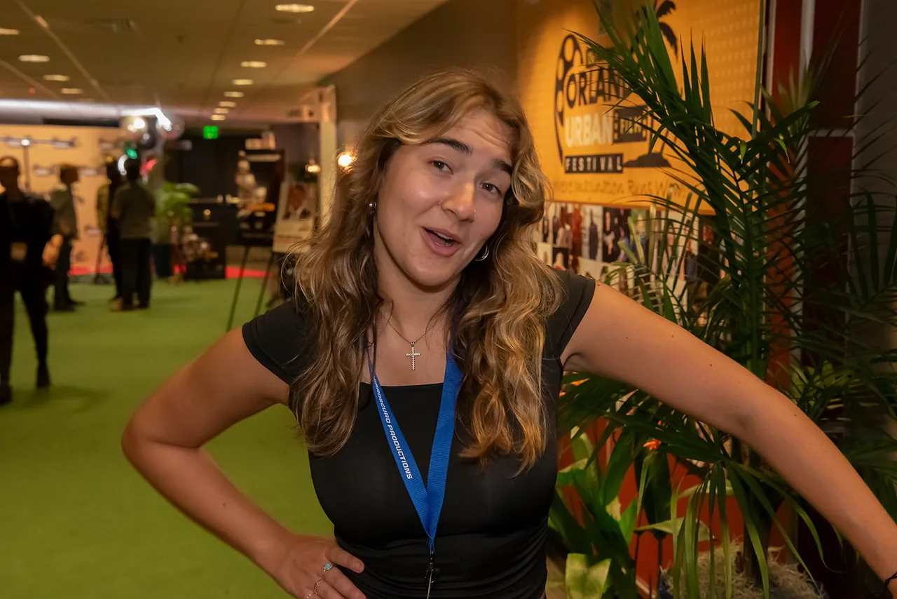 A guest posing playfully in the festival venue